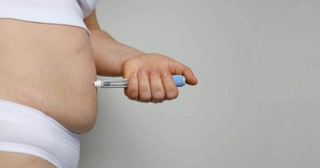 Caneta emagrecedora com elementos relacionados à perda de peso, como alimentos saudáveis e equipamentos de exercício.